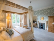 Traditional tiled fireplaces & well chosen wallcoverings create a tranquil atmosphere
