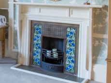 The restored Victorian fireplace helps add an authentic character to this former mill owners villa