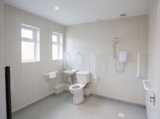 An accessible wet room has been designed to accommodate less able guests